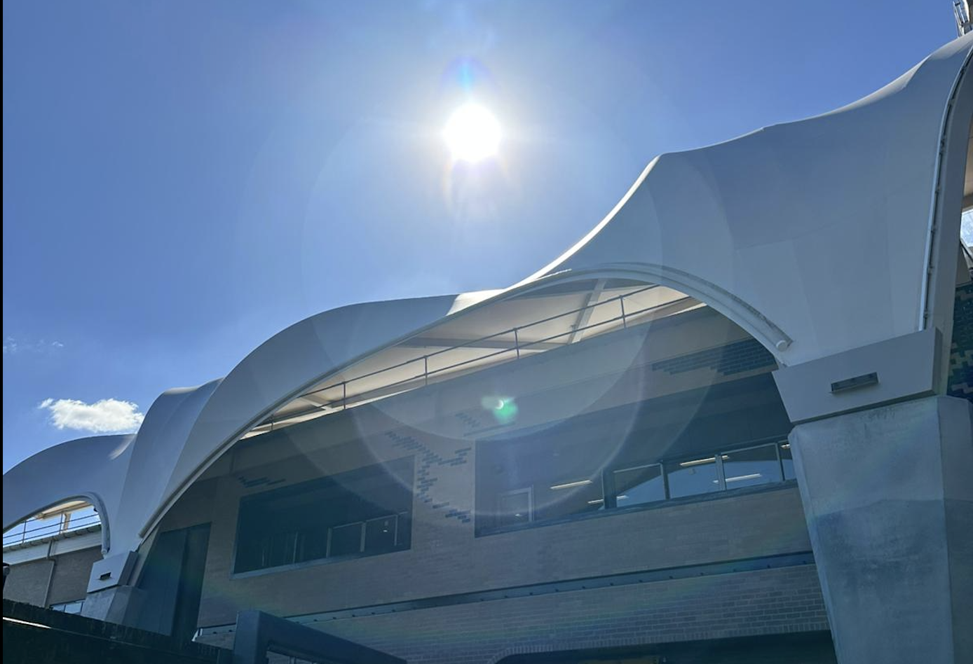 Architectural tensile fabric canopy at dusk